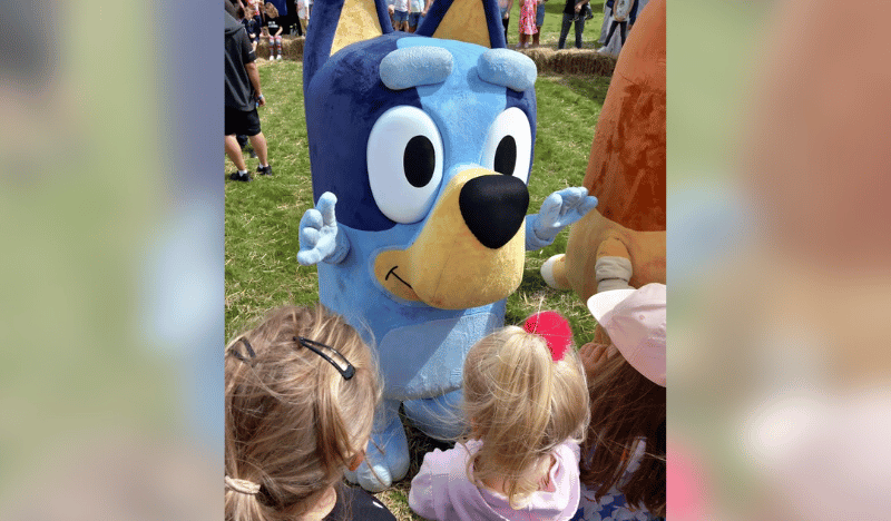 Bluey the character meeting the children