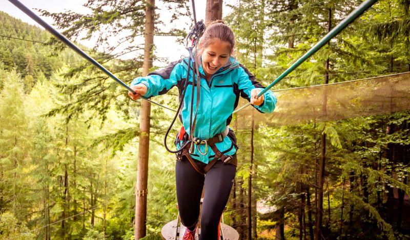 Young girl with a hard hat on at Go Ape!