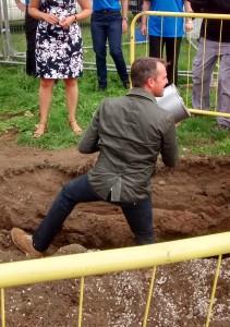 Graeme Swann gets stuck in burying the time capsule