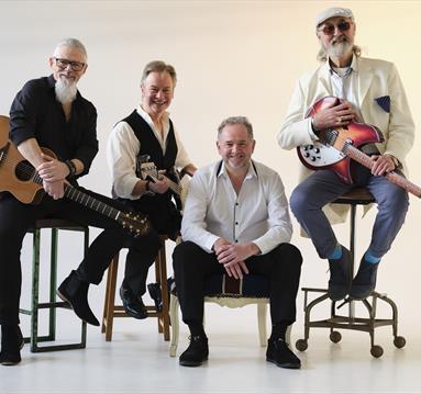 band of four people
