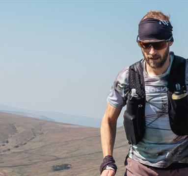 Ultrarunner Damian Hall in a remote, mountaintop setting