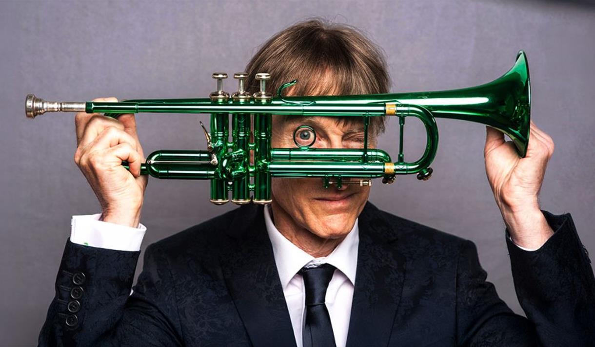 image of Paul Higgs holding a trumpet