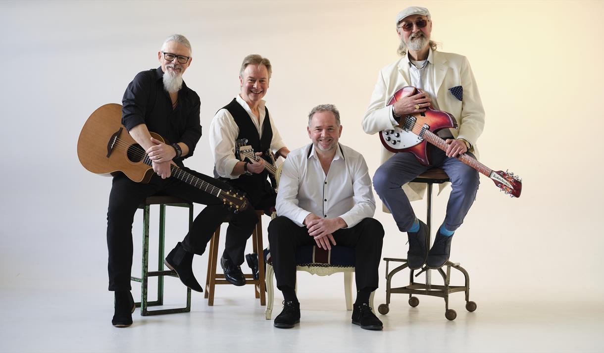 band of four people
