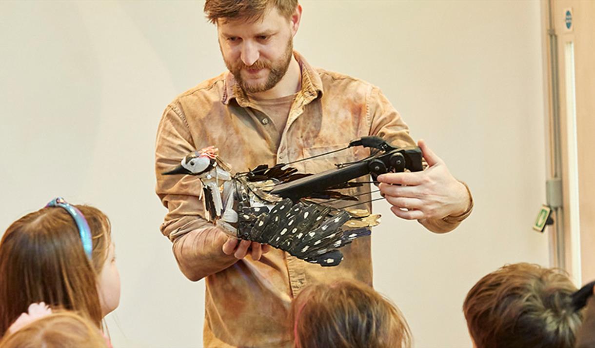 man presenting a workshop to children