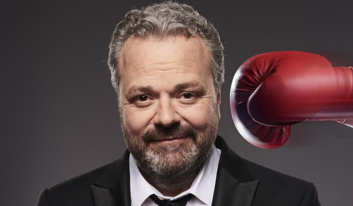 Hal Cruttenden being hit with a boxing glove