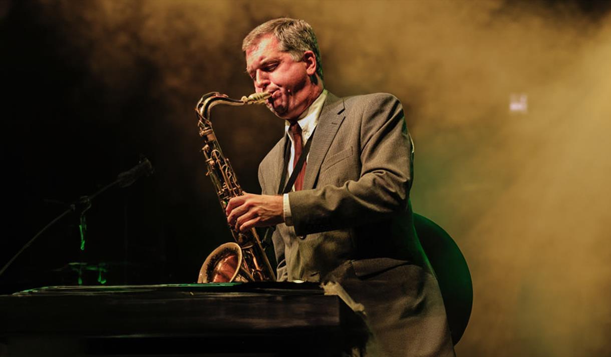 man playing saxaphone