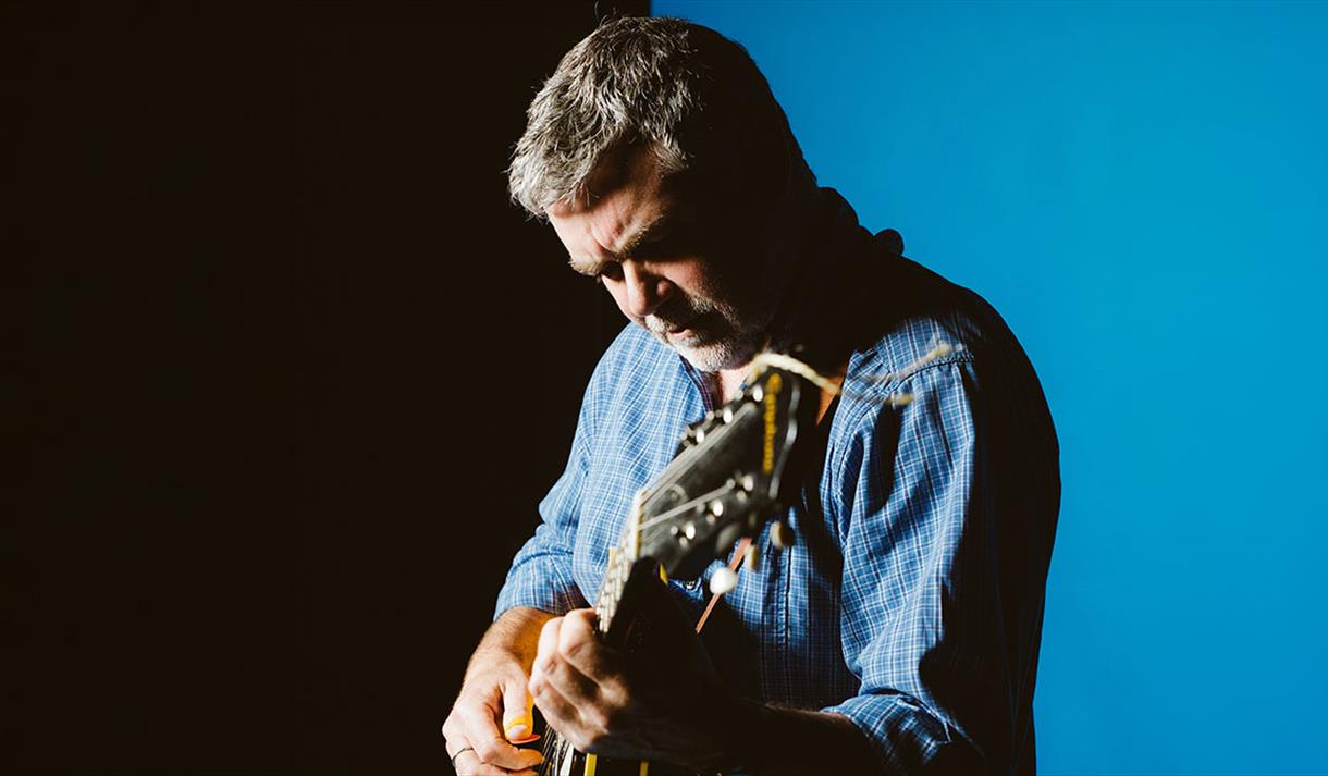 man playing guitar