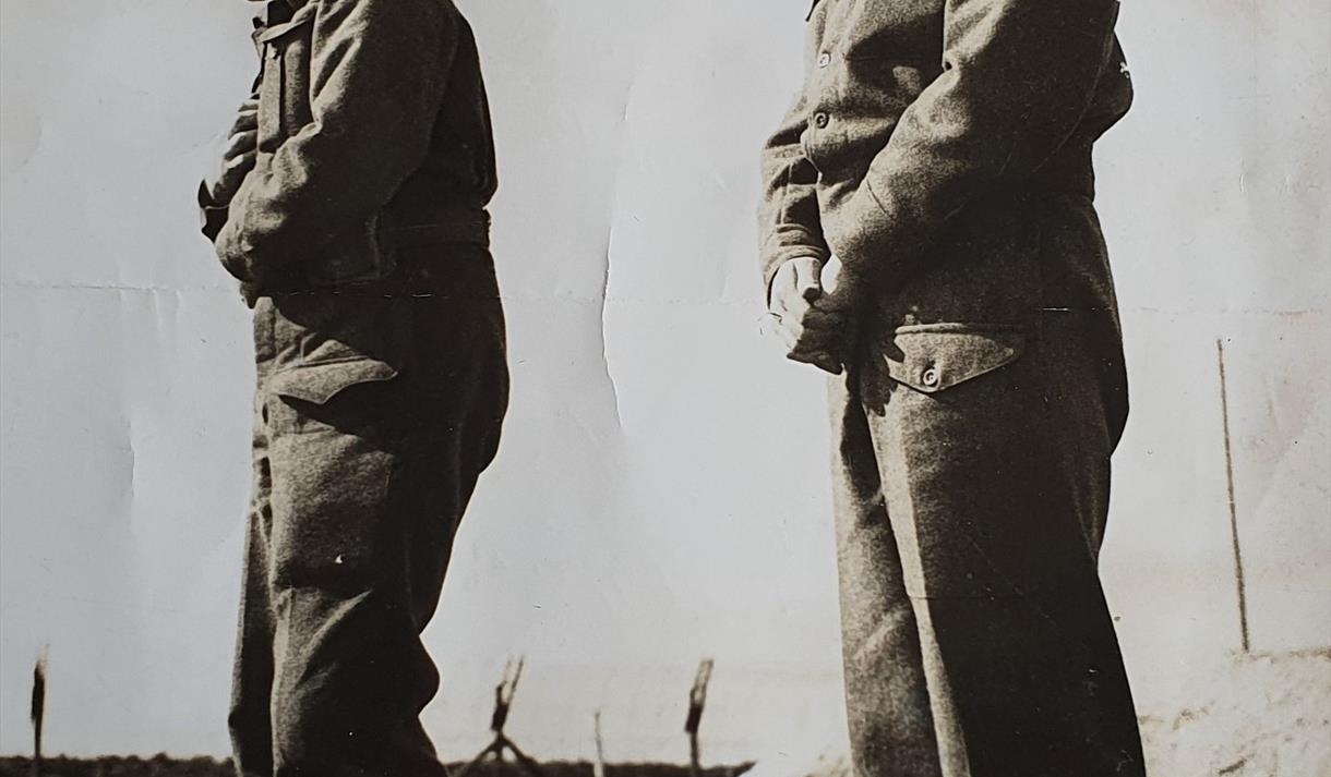 Sepia photograph of two soldiers.