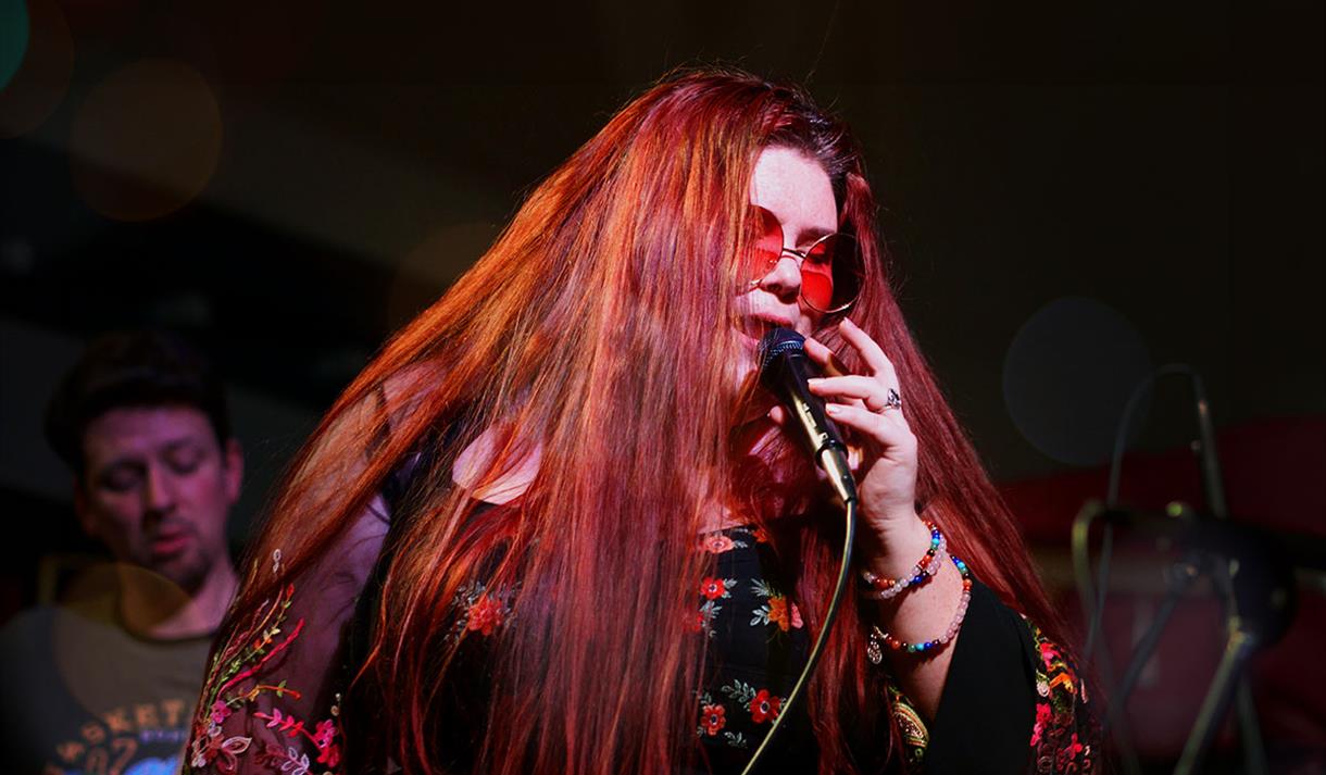 Photo of Alice Armstrong performing on stage