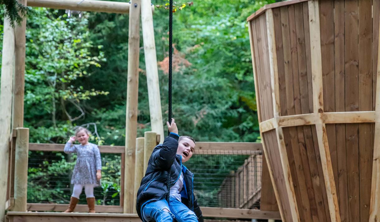 Young child on an aerial slide