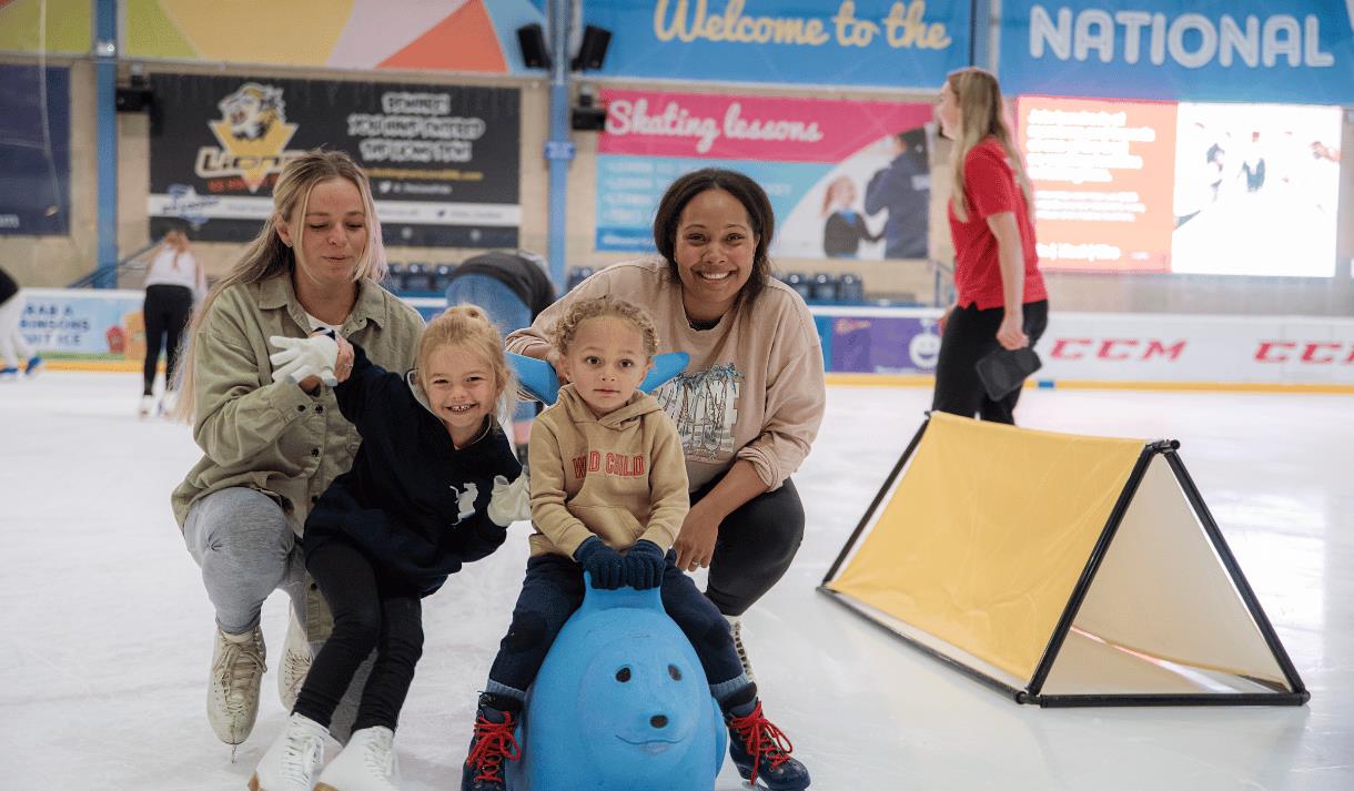 Photo of kids and their mums faving fun on the ice