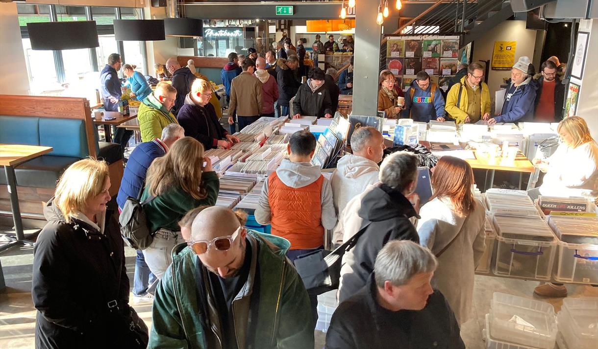 Vinyl collectors look through boxes and boxes of records