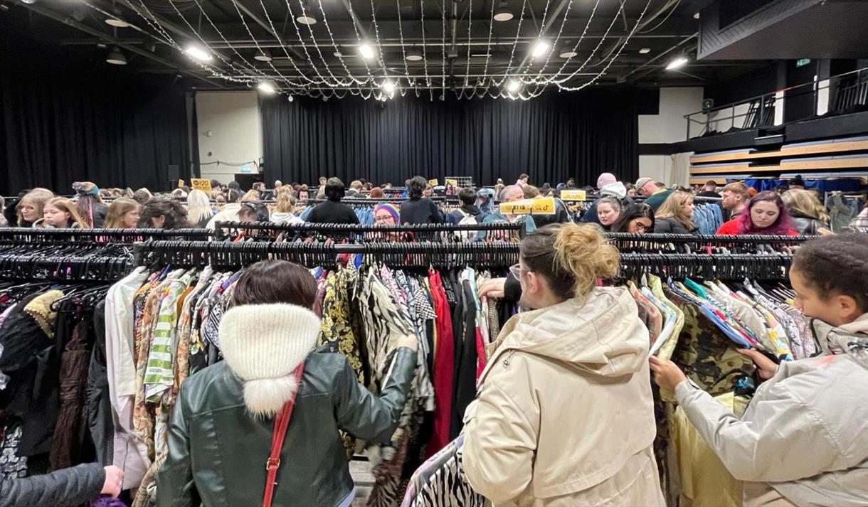 Photo of racks of clothes at a kilo sale