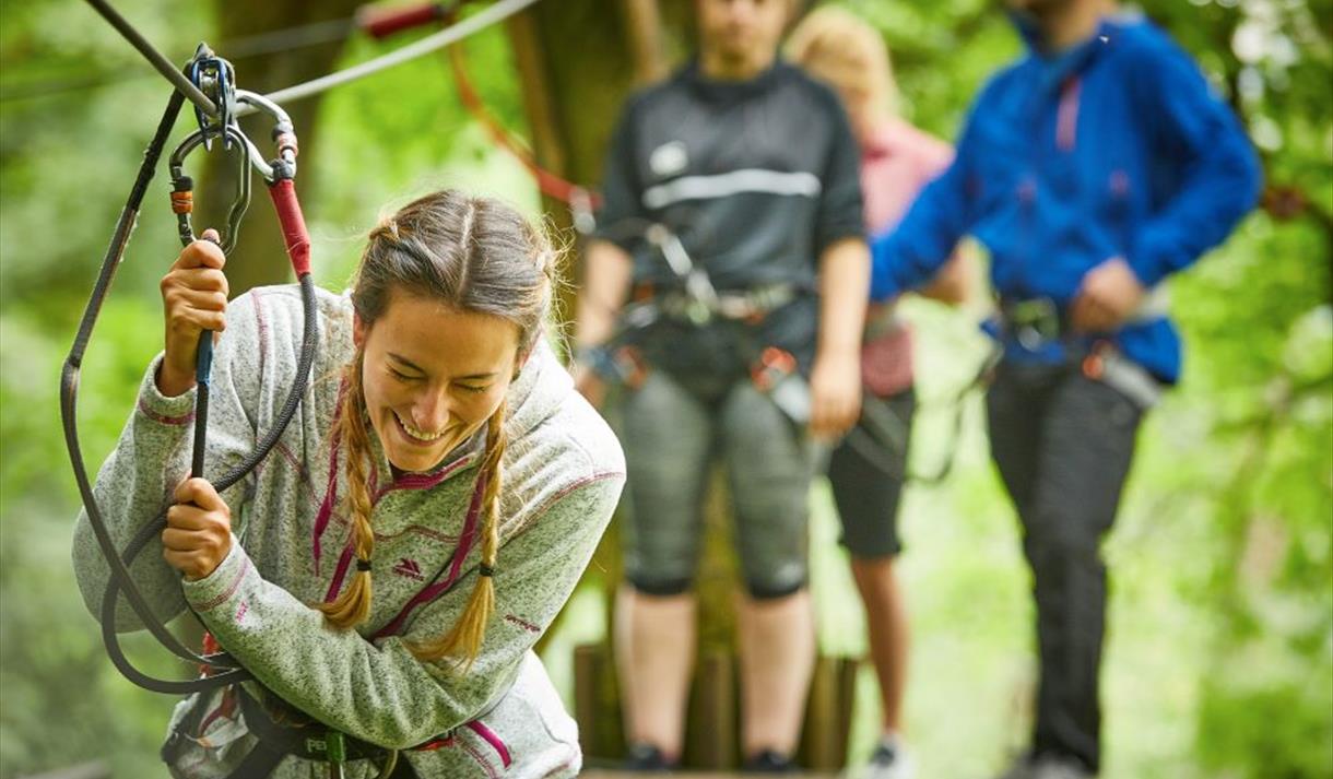 Young woman on hire wire course