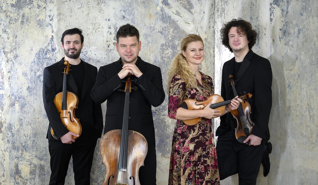 The image shows the members of the Pavel Haas Quartet.
