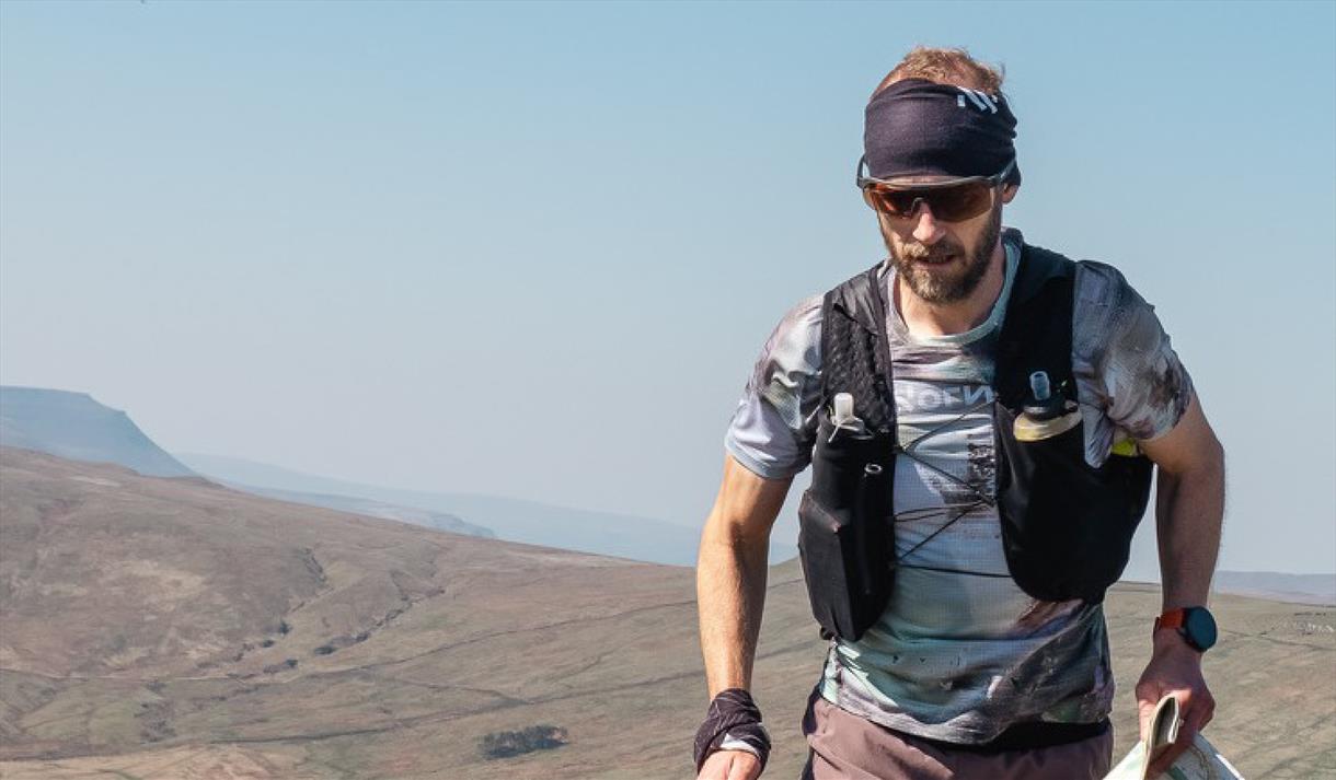 Ultrarunner Damian Hall in a remote, mountaintop setting