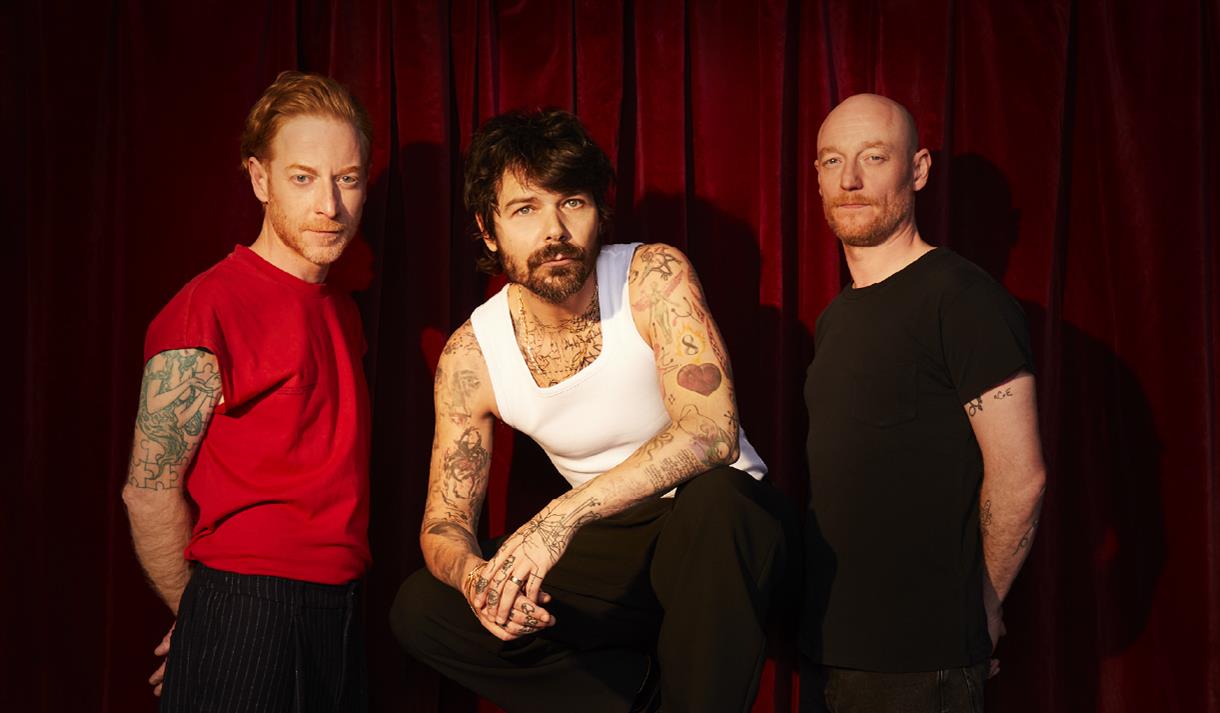 Image of the three members of Biffy Clyro