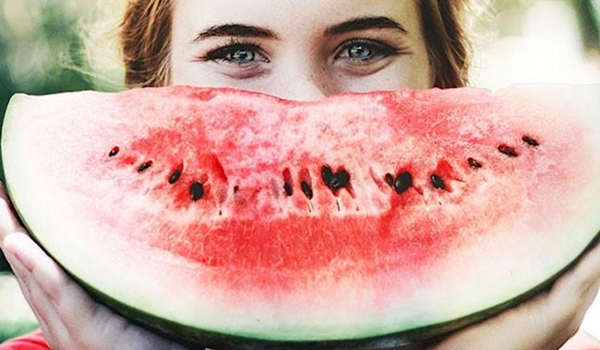 Woman smiling with watermelon