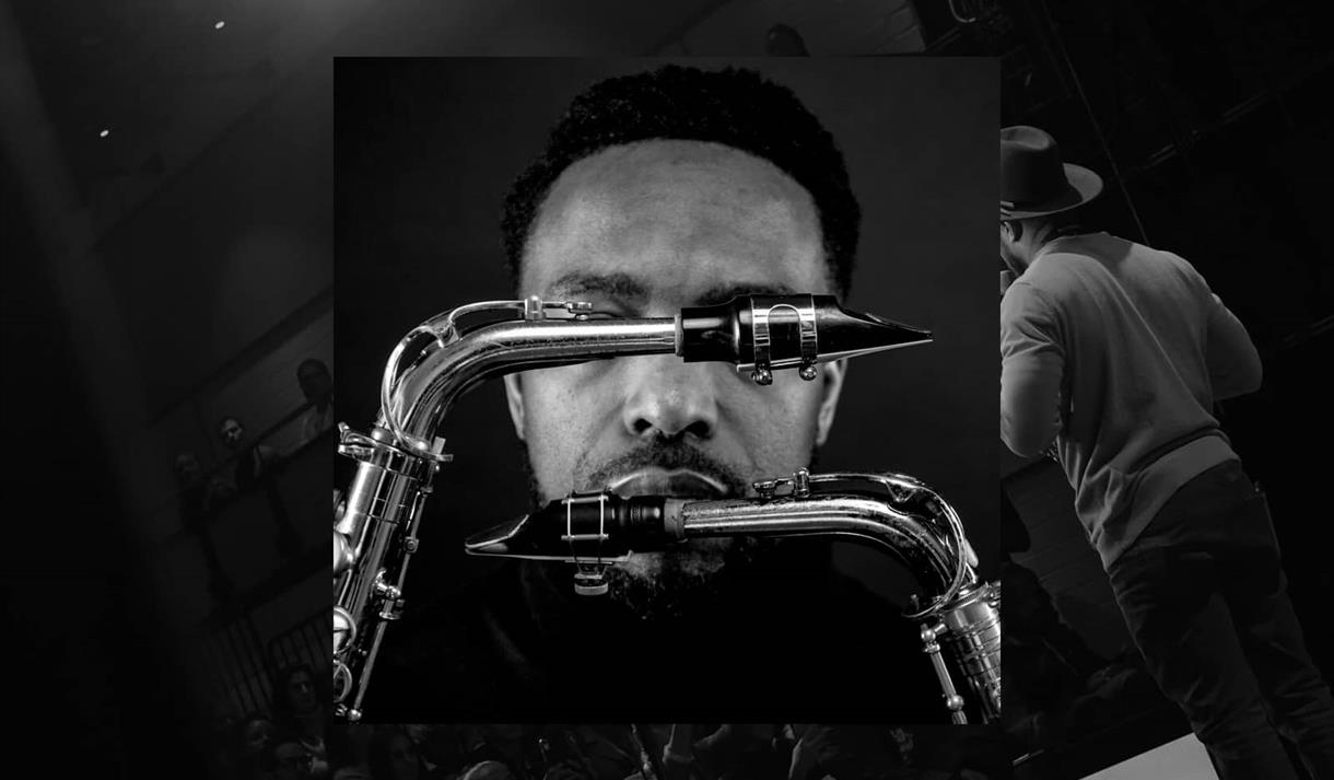 In the background, there is a black and white photo of a jazz event. Overlayed on top of this in the centre is a close up headshot of a man with saxop