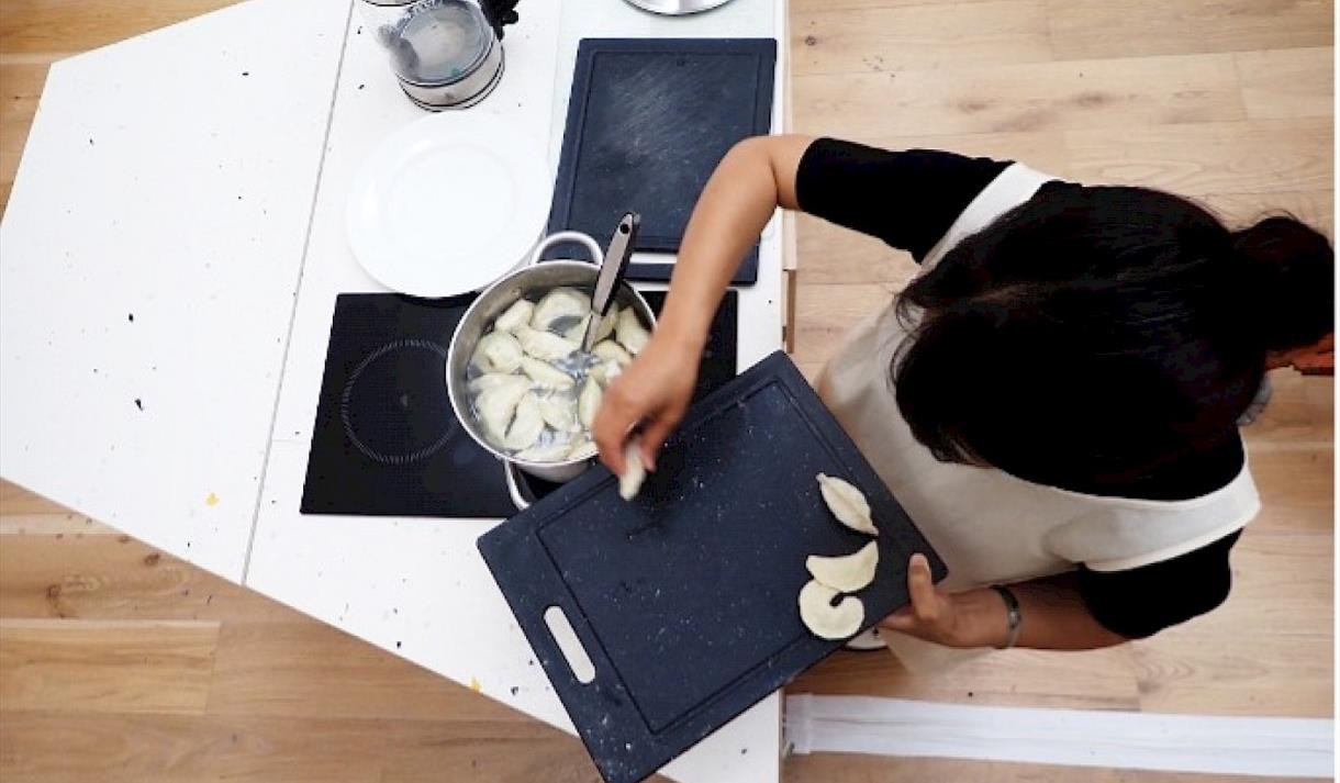 Overhead shot of a chef cooking on a hob