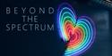 Beyond the Spectrum logo with a neon heart in rainbow colours